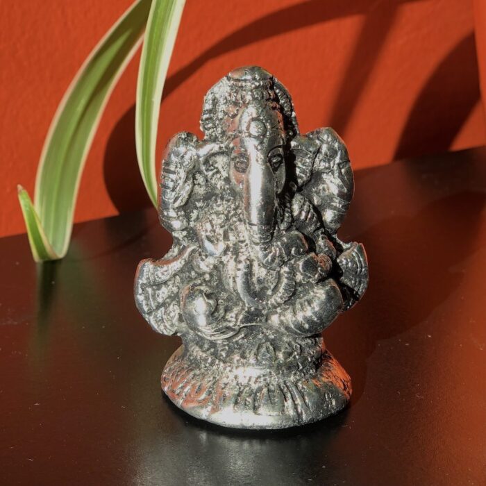 Ganesha idol in antique silver finish.